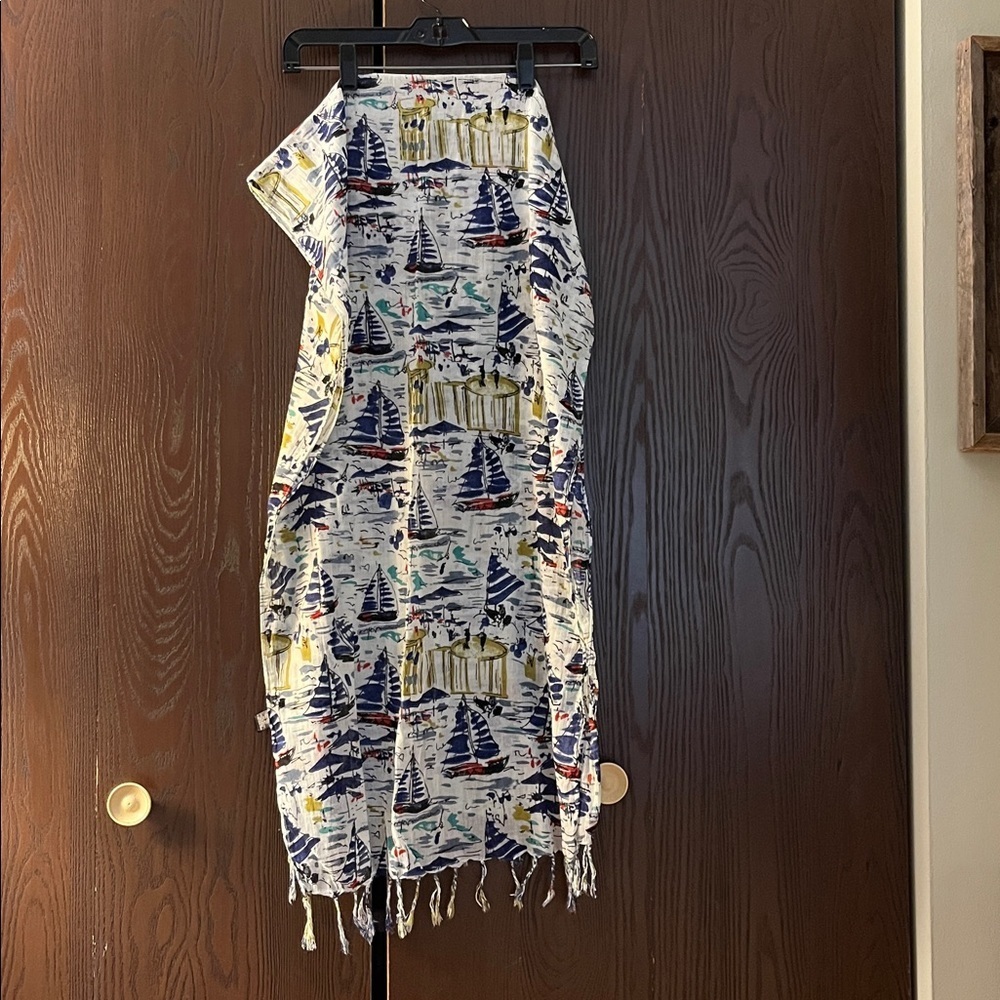 Scarf white with boats in navy blue and red. 70 by 21 inches.